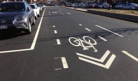 Brighton Avenue in Allston is sporting some new "super sharrows." Image: ##http://www.boston.com/news/local/blogs/starts-and-stops/2013/11/20/boston-bikes-debuts-sharrows-steroids/PXrtrx9c1YO6T0JOCn3vFJ/blog.html## Boston.com##