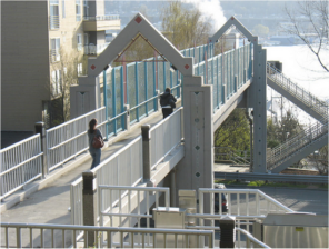 Projects like this pedestrian bridge aren't really about making the world better for walkers, Cortright argues. They're about avoiding any inconvenience for drivers. Photo: ##http://taimages.railstotrails.org/1-Ped-Bike-Facilities/Galer-Street-Ped-BridgeSeattle/i-G4fWfCd##Rails-to-Trails Conservancy##
