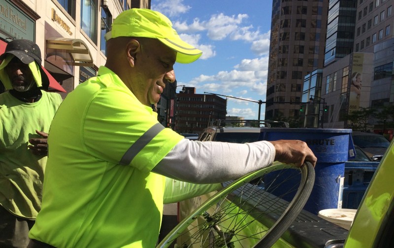 A staffer from Hartford's downtown business improvement district responds to a call for a bike repair. Photo: Hartford BID