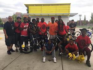 Oboi Reed, founder of Slow Roll Chicago, -- shown here in orange -- has been a leading voice for racial equity in transportation planning. Photo: Slow Roll Chicago