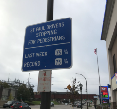 These signs, deslayed at eight intersections in St. Pau used physiological concepts like "social norming" and "implied surveillance" to increase driver yielding at intersections. Photo:  @Indy_Austin/Twitter