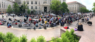 Angry cyclists spilled into the streets outside of City Hall Friday in D.C. following the death of a prominent cycling advocate. Photo:  Alex Block