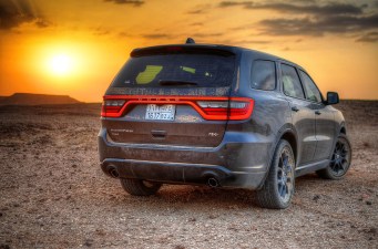 Photo of SUV gazing out over the arid hellscape of its own creation via Creative Commons.