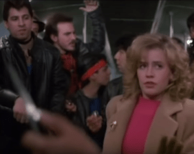 Why yes, in fact, that is a racist depiction of a gang of mostly brown people menacing a white woman with a knife on a public train.