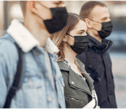 These people should be standing further apart — but their risk of COVID-19 transmission is still probably lower than if they were doing the same thing indoors. Source: Creative Commons.