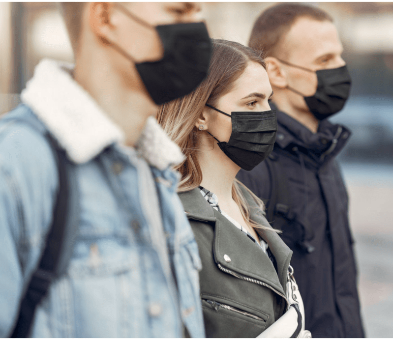 These people should be standing further apart — but their risk of COVID-19 transmission is still probably lower than if they were doing the same thing indoors. Source: Creative Commons.