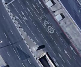 This 30 km per hour "slow" lane in Madrid is sandwiched squarely between high-speed driving lanes on a 7 lane arterial — and cyclists are required by law to ride in the middle of it. Source:  Google Maps via Cycling Savvy.