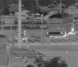 A thermal camera captures a clear image of a pedestrian crossing a roadway. Source: Device-Alab