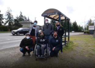Disability rights advocates at the bus stop. Photo: Disability Mobility Initiative