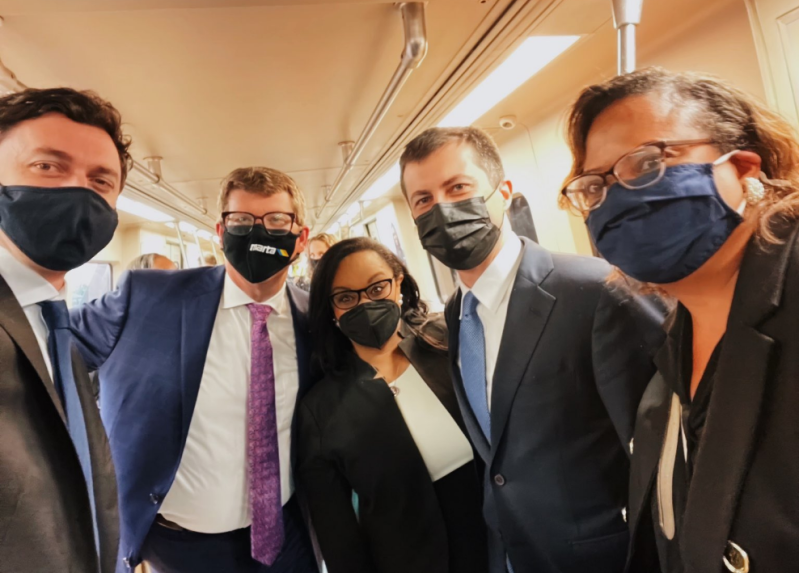 Local Democrats show U.S. Transportation Secretary Pete Buttigieg light rail in Atlanta. Sen. Jon Ossoff is at left. At center is Ossoff on the far left and Rep. Nikema Williams.