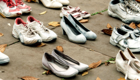 Each pair of shoes in this demonstration represents a life lost to traffic violence. Via Families for Safe Streets