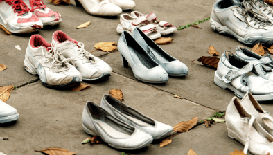 Each pair of shoes in this demonstration represents a life lost to traffic violence. Via Families for Safe Streets