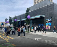 People gather on NE 43rd Street to celebrate the opening of the U District light rail station. Photo: Natalie Bicknell Argerious