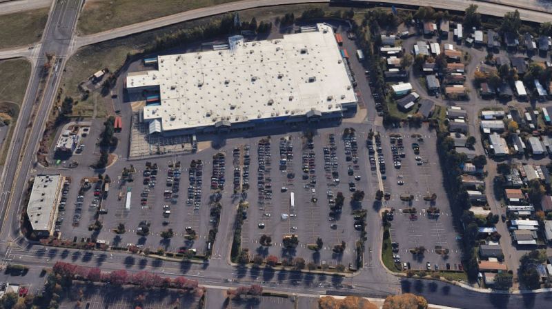 Aerial image of a half-empty Walmart parking lot. (Photo from Google Earth.)