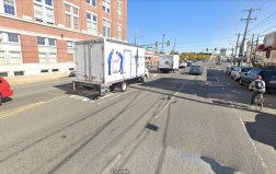 A cyclist rides in an unprotected door-zone bike lane on Washington Avenue. Photo: Google