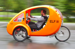 This vehicle has pedals, a battery-powered motor, three wheels, and a top speed of 20 miles per hour. So is it an "e-bike"? Photo: Electrek